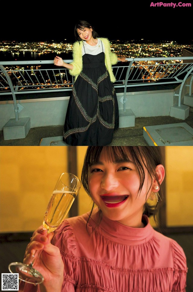 A woman holding a glass of champagne on top of a building.